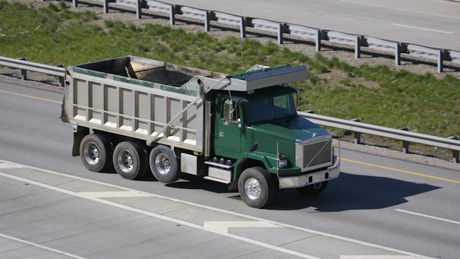green dump truck on highway