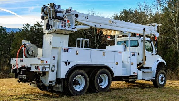 Altec Digger Derrick utility truck parked outdoors, part of the 2024&ndash;2025 Altec recall for front bumper detachment risk.