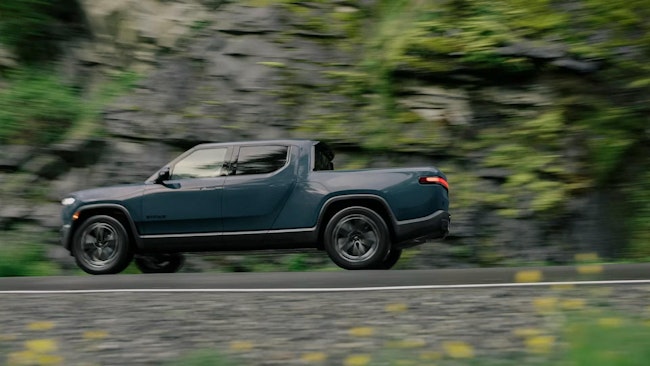 2025 Rivian R1T electric truck with visible high-voltage components, affected by recall FSAM-1723 for improperly grounded connection causing potential drive power loss.