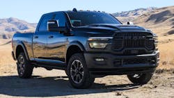 2025 black Ram 2500 pickup truck parked in a desert landscape, showcasing heavy-duty design and off-road capabilit 2025 black Ram 2500 pickup truck parked in a desert landscape, showcasing heavy-duty design and off-road capabilit