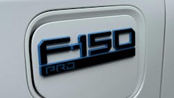 Logo for the Ford Lightning Pro on a white vehicle. Logo for the Ford Lightning Pro on a white vehicle.