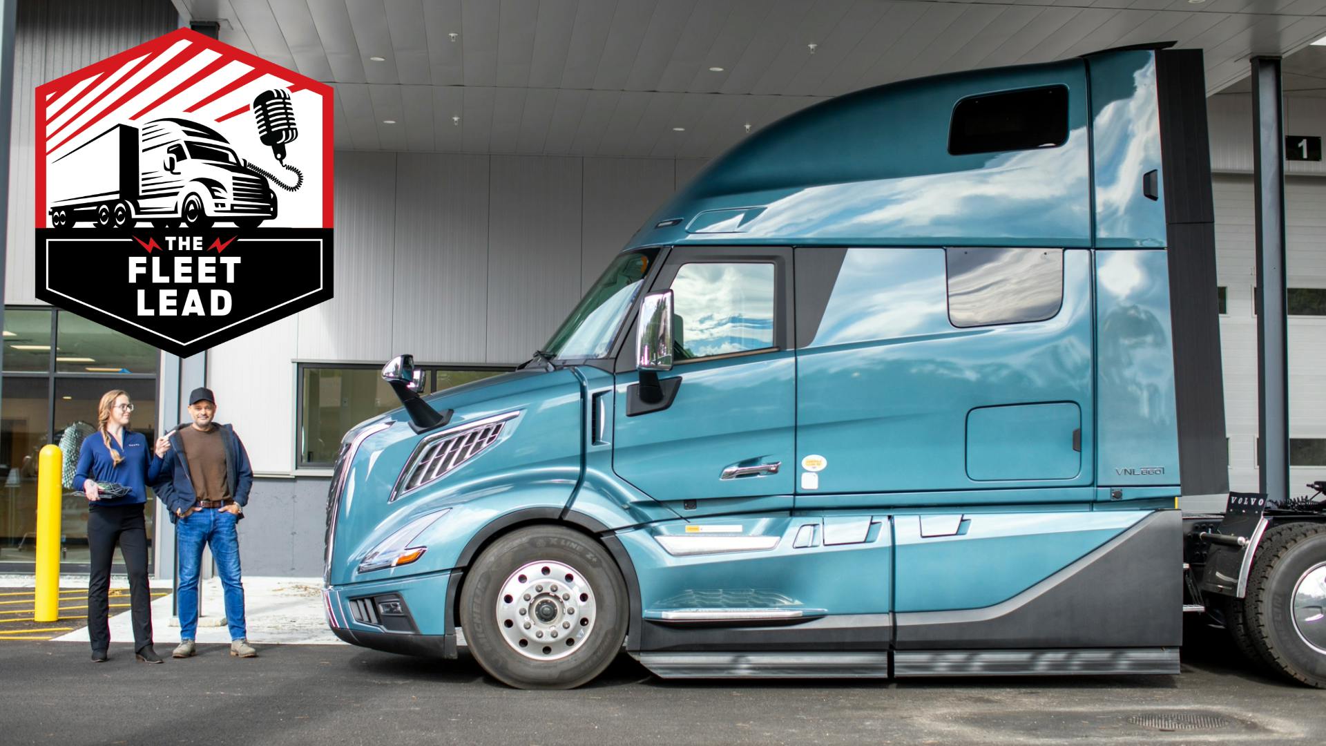 Service advisor posing with driver at truck