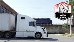 truck and train adjacent truck and train adjacent