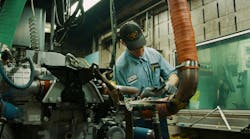 A technician conducts testing on a Detroit diesel engine at Daimler Trucks' Detroit Manufacturing Plant. A technician conducts testing on a Detroit diesel engine at Daimler Trucks' Detroit Manufacturing Plant.