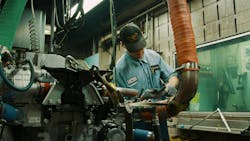 A technician conducts testing on a Detroit diesel engine at Daimler Trucks' Detroit Manufacturing Plant. A technician conducts testing on a Detroit diesel engine at Daimler Trucks' Detroit Manufacturing Plant.
