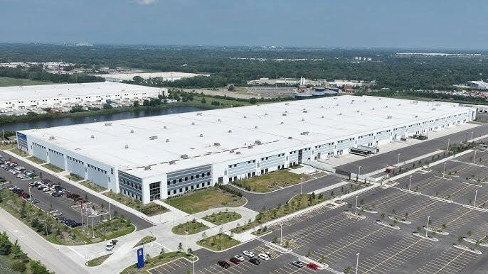 Exterior view of the large industrial manufacturing facility in Will County, Illinois, formerly occupied by Lion Electric, now a future site for Hyundai Translead trailer production.