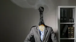 lose-up of a worker with the head of match that is burned out but still smoking, representing modern worker burnout lose-up of a worker with the head of match that is burned out but still smoking, representing modern worker burnout