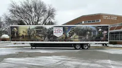 The wrap depicts a timeline of U.S. history, accompanied by images of George Washington, scenes from past wars, and more. The wrap depicts a timeline of U.S. history, accompanied by images of George Washington, scenes from past wars, and more.