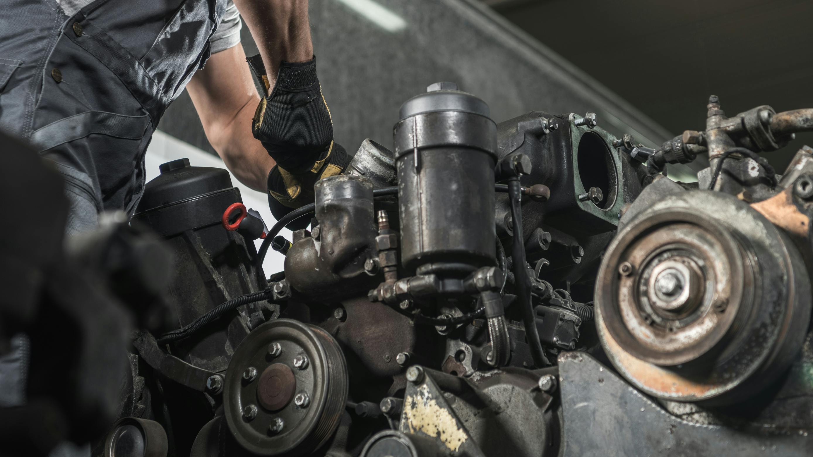 diesel mechanic repairing engine