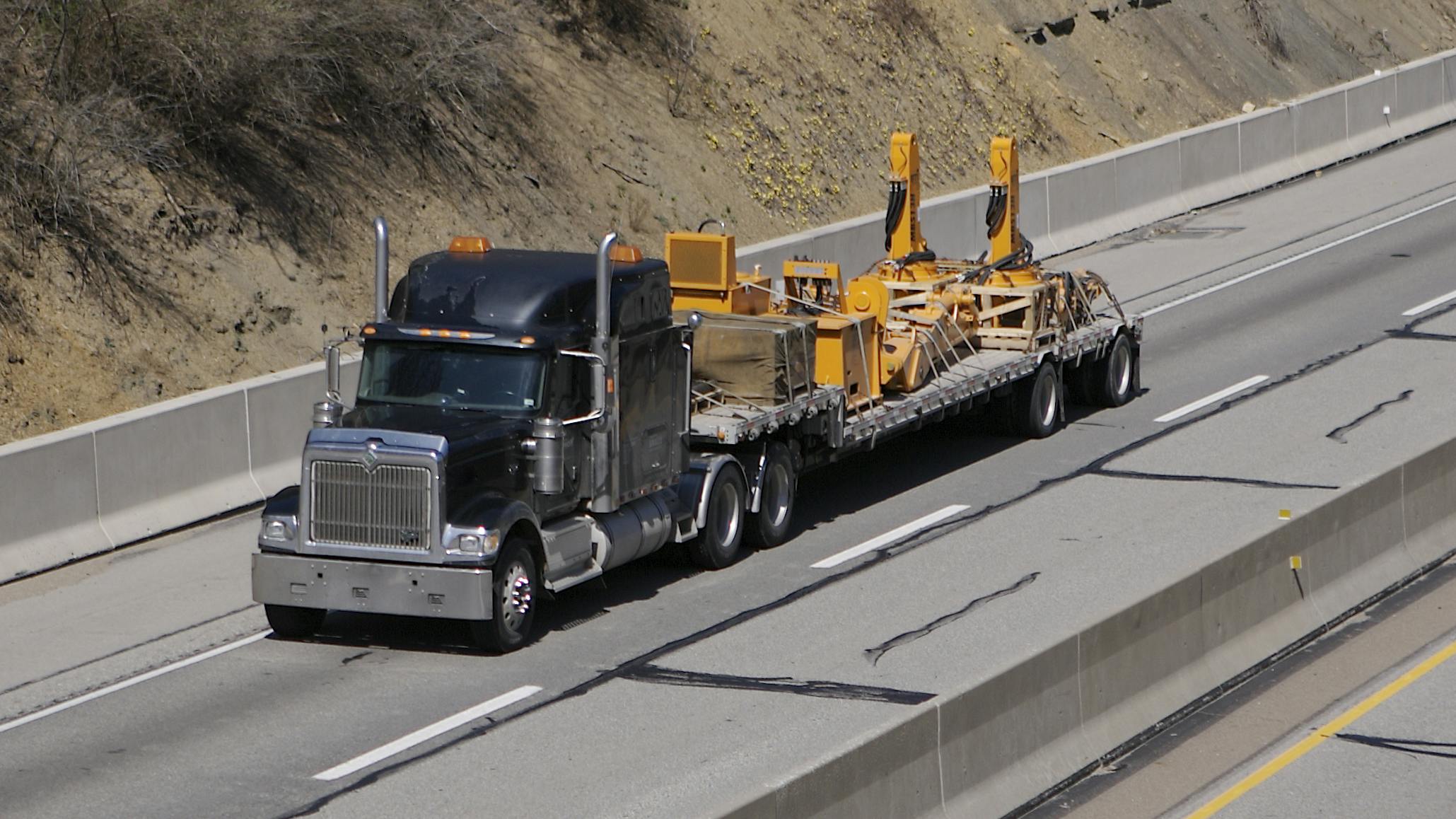 flatbed truck hauling load