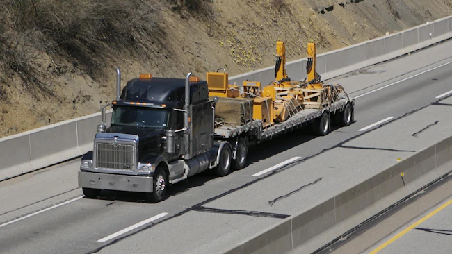 flatbed truck hauling load