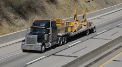 flatbed truck hauling load